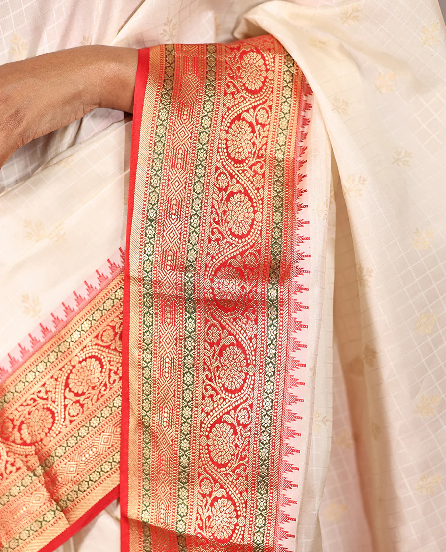 Cream Vasundhara Silk Saree, Subtly Sparkled with Buttas And Checks On Its Body, Complemented by Captivating Contrast Border of Thazampoo Rekku, Muthu, Banaras, and Kodi Visiry Designs, Pallu Steeped with Manga Designs, And Paired with a Contrast Blouse - Image 4