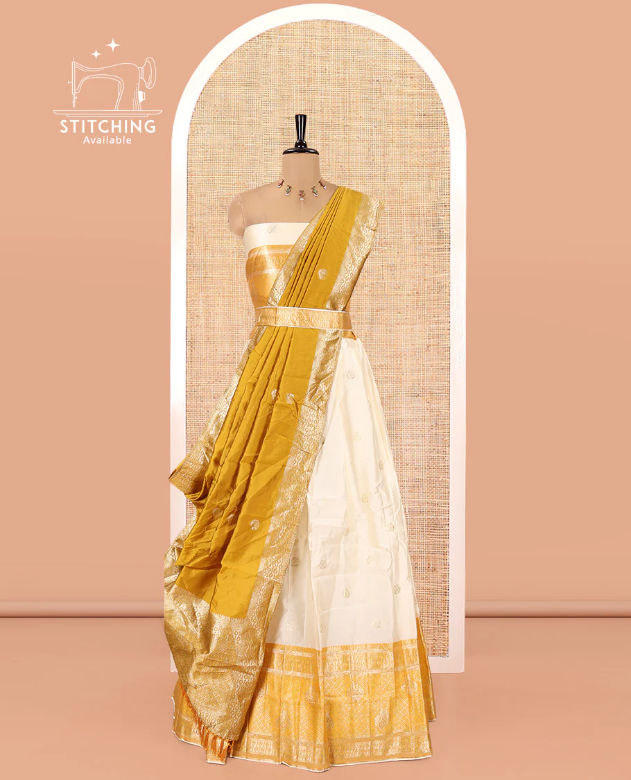 Cream-Yellow Semi-Banarasi Half-Saree Set Featuring Buttas Skirt, Contrast Traditional Border, Matching Blouse, and Banaras Dhavani