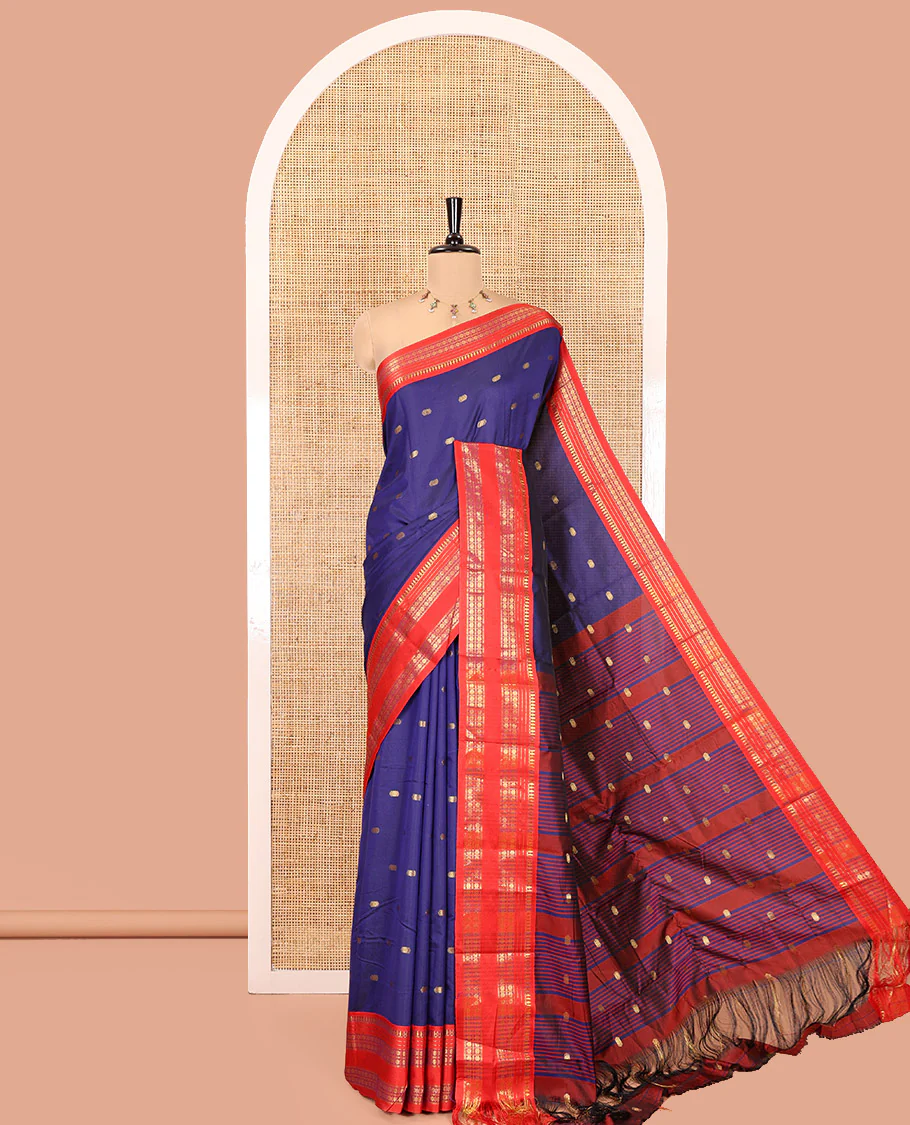 Dark Blue Softy Silk Saree, Delicately Woven With Zari Buttas All Over Its Body, Complemented by Contrast Traditional Zari Varisai Pettu Border, Grand Pallu, and Paired with a Contrast Blouse