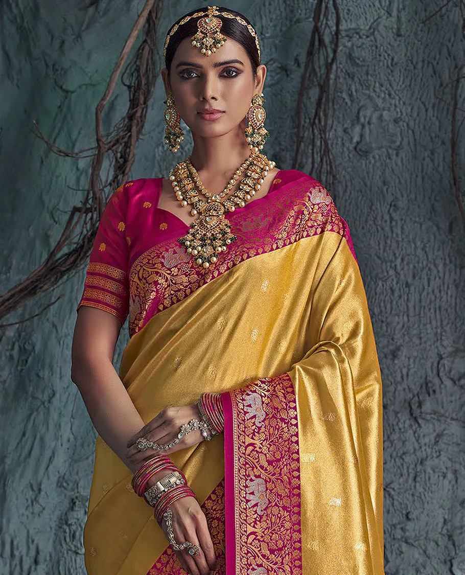 Gold Designer Saree, Subtly Sparkled with Buttas All Over Its Body, Complemented by a Contrast Floral and Elephant Border, Pallu of Intricate Designs, and Paired with a Contrast Blouse - Image 2