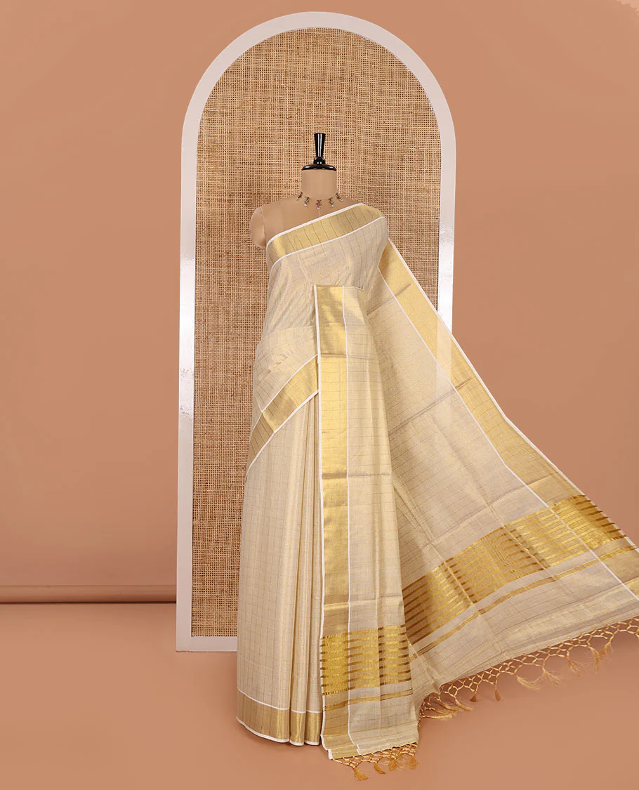 Gold Kerala Cotton Saree, Gleamed Up with Medium-Sized Checks All Over Its Body, Subtle Bavanji Border, Scintillating Zari Design Pallu, and Paired with a Matching Blouse