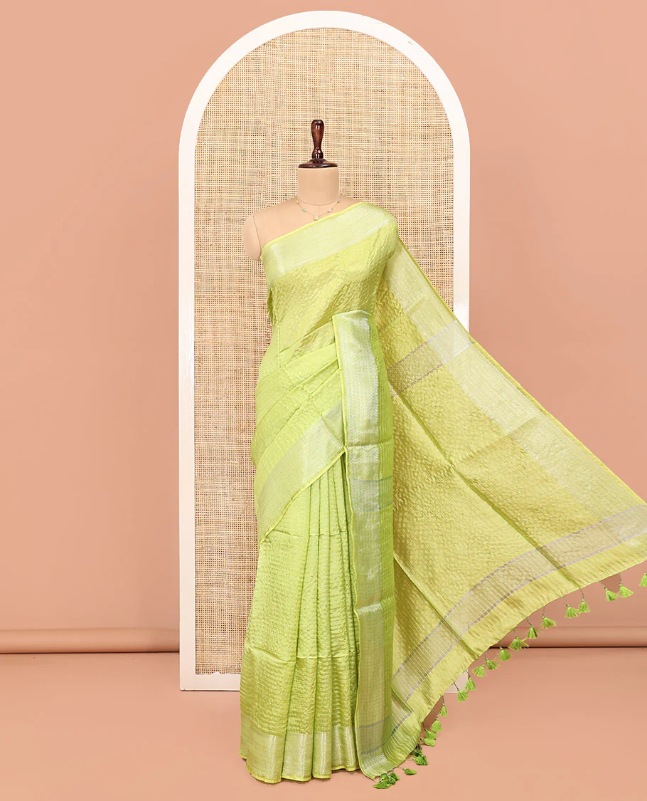 Green Banana Pith Saree, Sparsely Woven with Stripes All Over Its Body, Subtle Self-Border of Jaal Designs, Pallu Steeped with Stripes, and Paired with a Matching Blouse