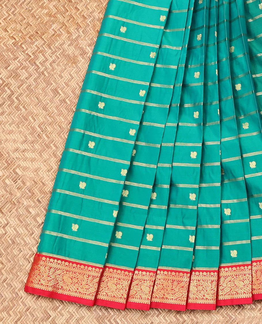 Green Budget Silk Saree, Enriched with Peacock Zari Buttas and Stripes on Its Body, Complemented by a Contrast Traditional Zari Rettai Pettu Border, Grand Jaal Pallu, and Paired with a Contrast Blouse