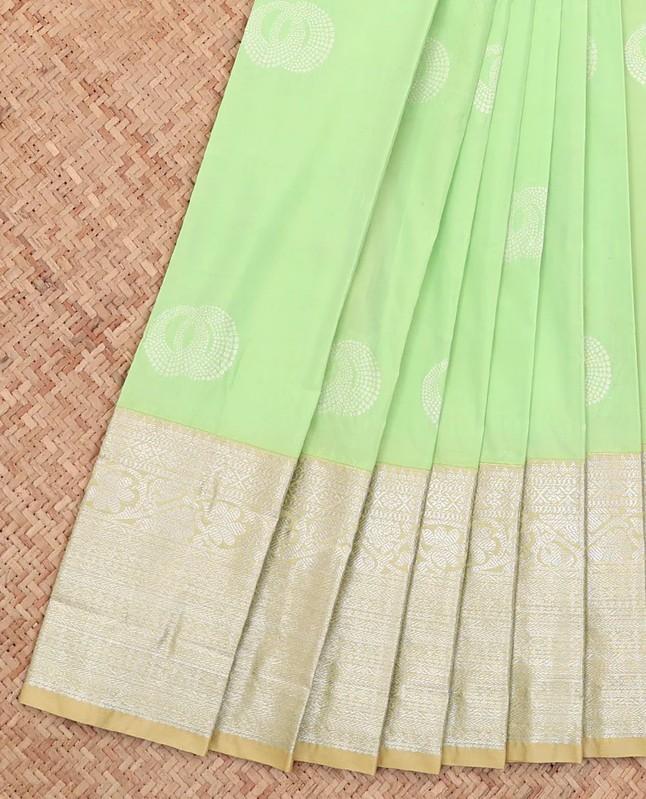 Green Budget Silk Saree, Subtly Sparkled with Buttas All Over Its Body, Complemented by a Contrast Traditional Zari Design Border, Grand Pallu, and Paired with a Contrast Blouse