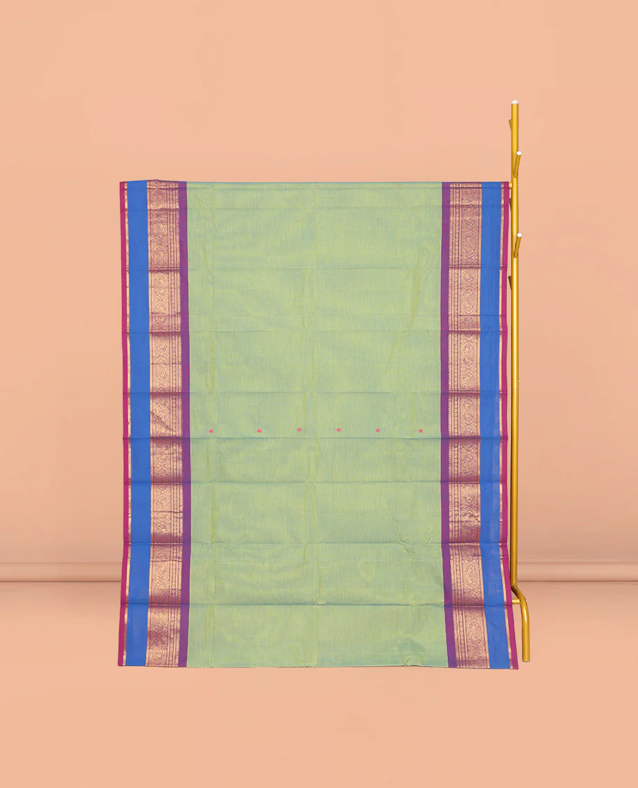 Green Chettinad Cotton Saree, Ornamented with Buttas All Over Its Body, Complemented by a Contrast Traditional Zari Rettai Pettu Border, Pallu of Stripes and Buttas, and Paired with a Matching Blouse