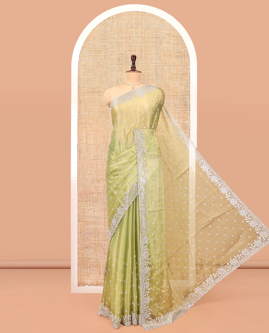 Green Designer Saree, Gleamed up with Stone Work All Over Its Body, Highlighted by Stone Embroidered Border, And Paired with a Matching Blouse