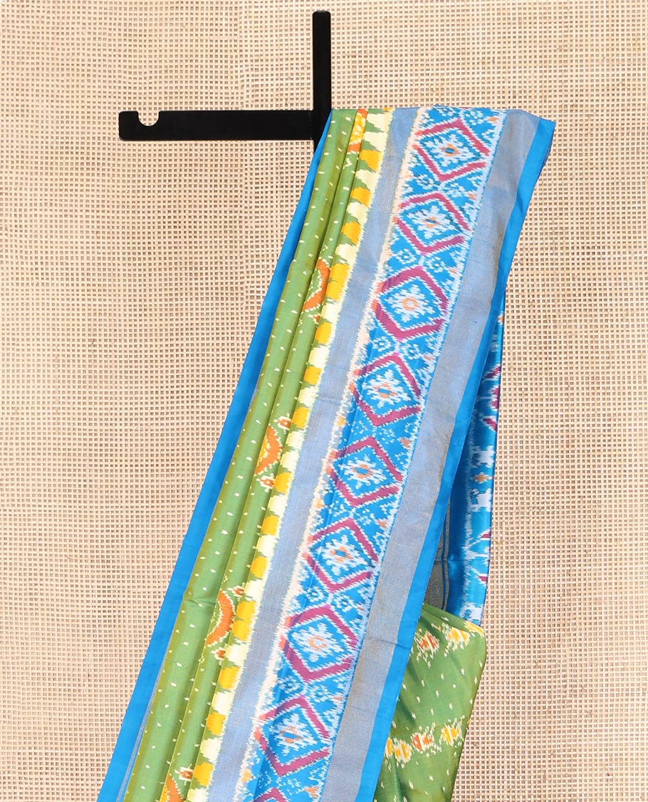 Green Ikkat Silk Saree, Enriched with Elephant Motifs Ikkat Weave All Over Its Body, Complemented by a Contrast Temple Border of Diamond Designs, Pallu of Ikkat Designs, and Paired with a Contrast Blouse - Image 3