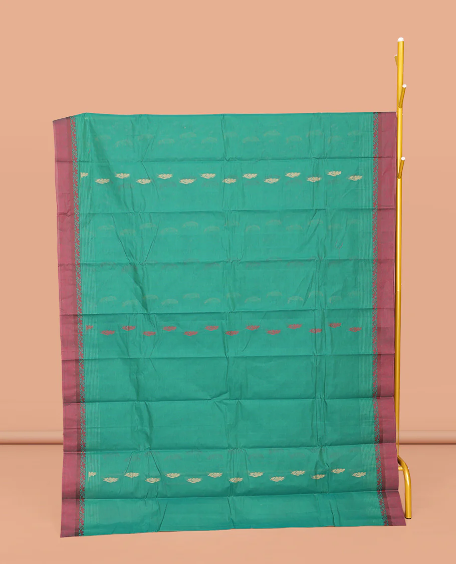 Green Kanchi Cotton Saree, Finely Crafted with Buttas All Over Its Body, Complemented by Contrast Border, Pallu of Floral Designs, and Paired with a Matching Blouse