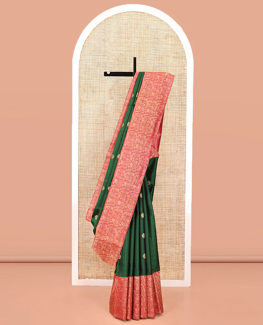Green Kanchipuram Designer Silk Saree, Entralled with Chakram Buttas All Over Its Body, Complemented by Contrast Historically Woven Border of Yaali and Yaanai Designs, Grand Jaal Pallu and Paired with a Contrast Blouse