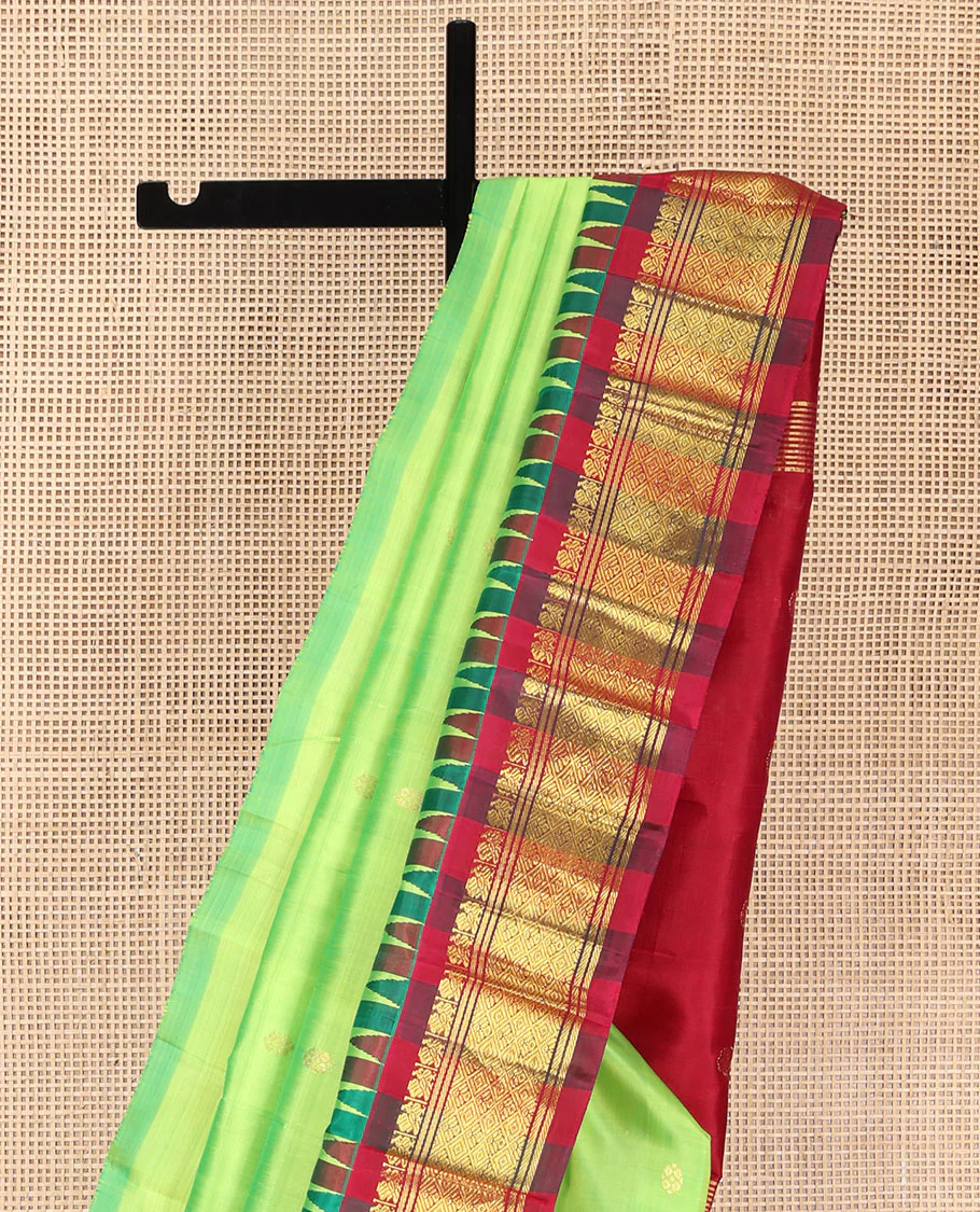 Green Kanchipuram Silk Saree, Delicately Woven with Zari Buttas on Its Body, Complemented by a Contrast One-Sided Thazampoo Rekku Border of Mayil and Jaal Designs, Pallu Depicts Zari Designs, and Comes Without a Blouse - Image 3