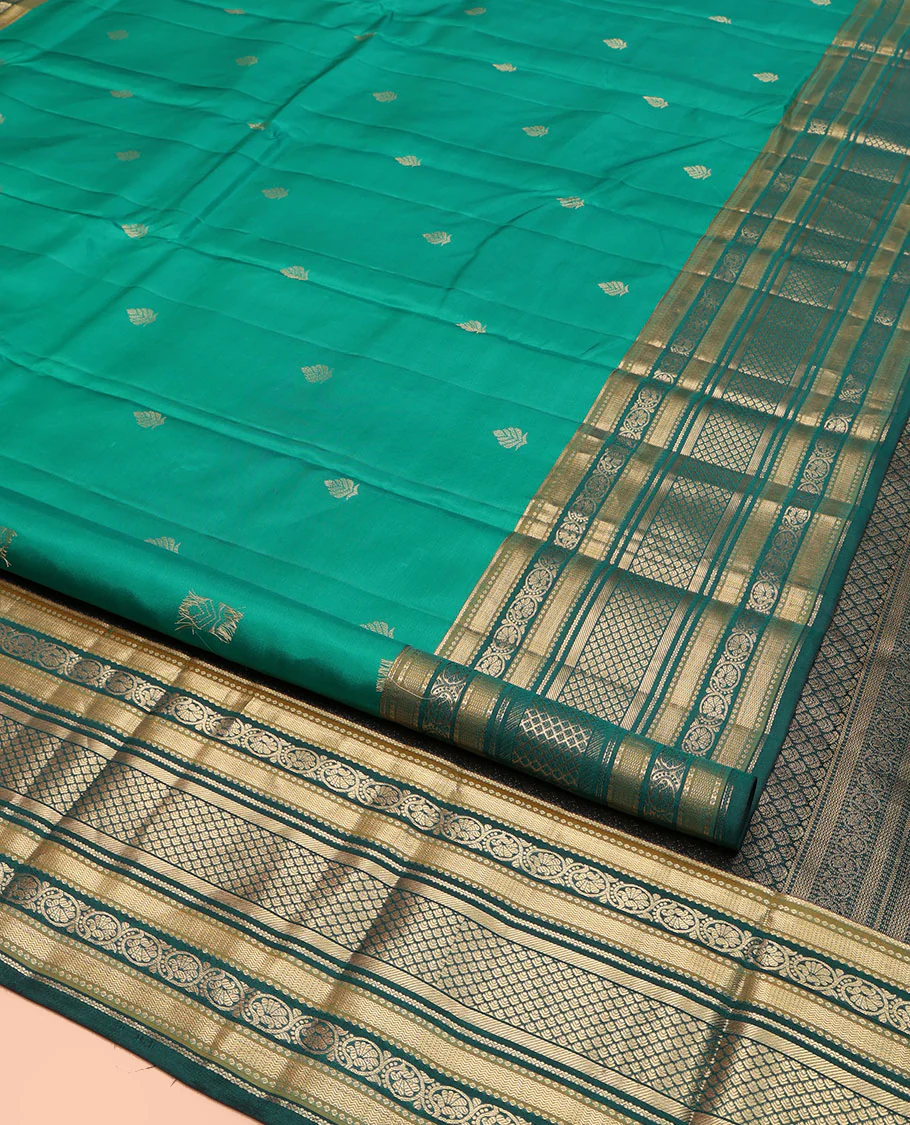 Green Kanchipuram Silk Saree, Detailed with Buttas on Its Body, Complemented by a Contrast Border of Vanki, Kodi Visiry, Neli, Banaras, and Jaal Designs, Grandly Jaal Woven Pallu, and Paired with a Contrast Blouse - Image 2
