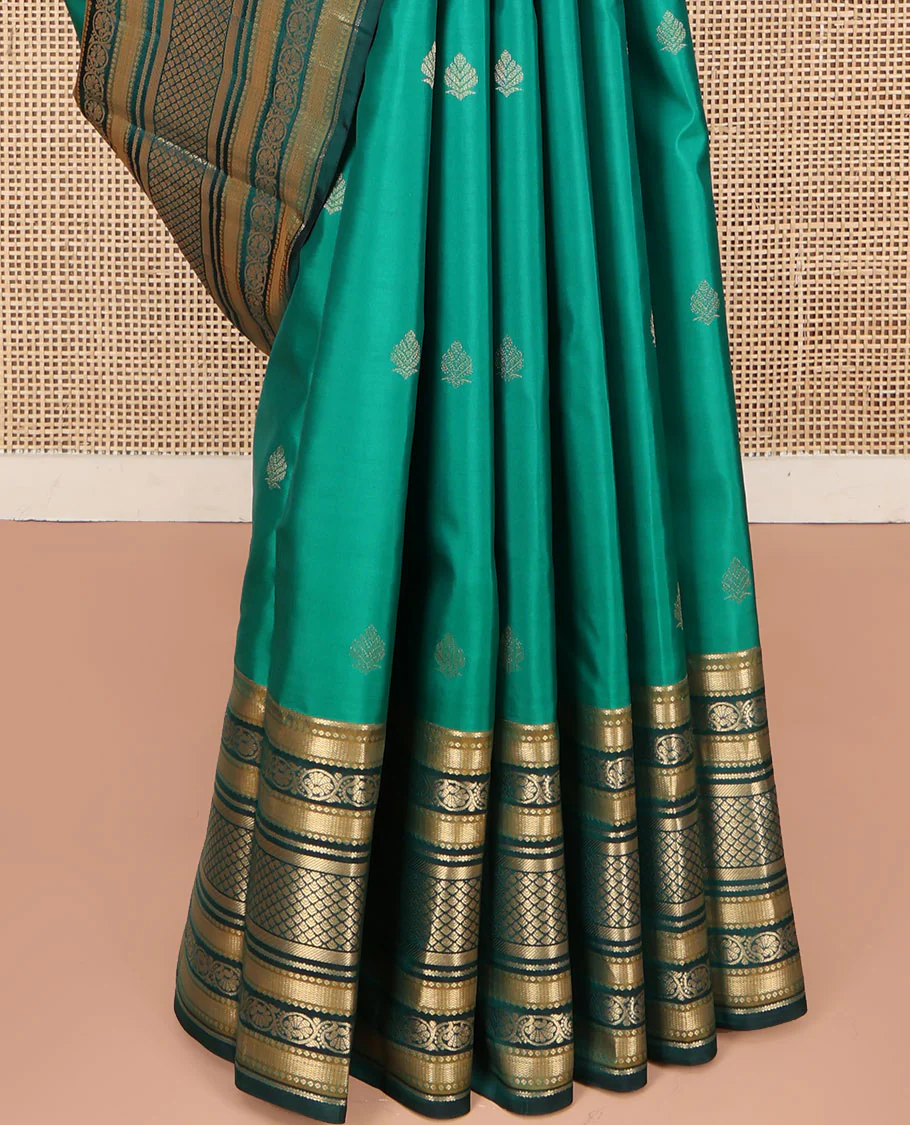 Green Kanchipuram Silk Saree, Detailed with Buttas on Its Body, Complemented by a Contrast Border of Vanki, Kodi Visiry, Neli, Banaras, and Jaal Designs, Grandly Jaal Woven Pallu, and Paired with a Contrast Blouse - Image 4