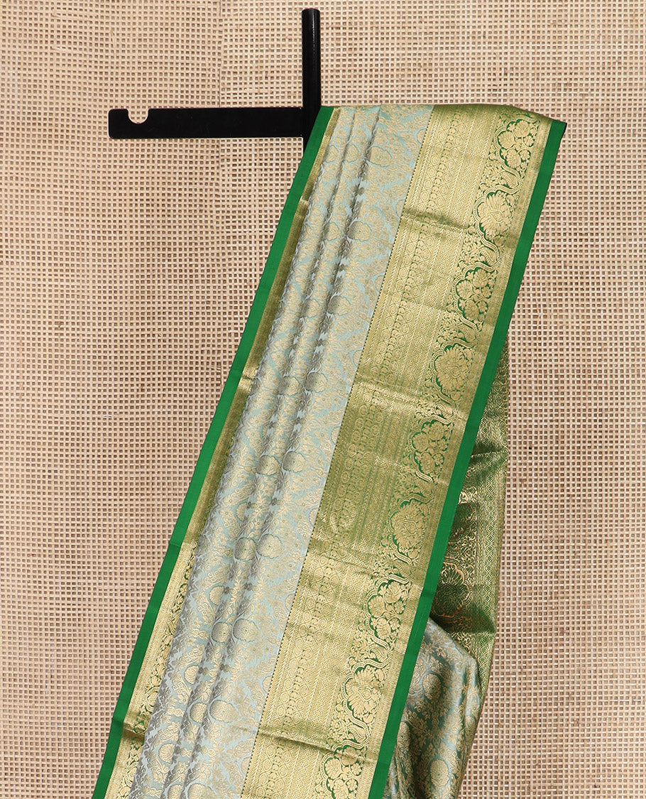 Green Kanchipuram Silk Saree Embellished with Jacquard Design, Highlighted by a Contrast Border of Thilakam, Muthu, Rekku, Manga, Chakram, and Floral Designs, Majestically Woven Pallu Steeped with Chakram Designs, and Paired with a Matching Blouse - Image 2
