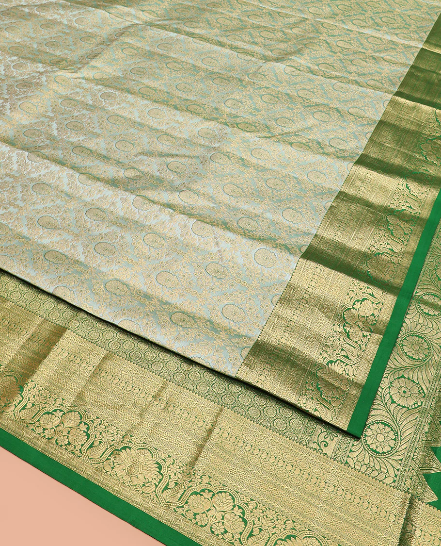 Green Kanchipuram Silk Saree Embellished with Jacquard Design, Highlighted by a Contrast Border of Thilakam, Muthu, Rekku, Manga, Chakram, and Floral Designs, Majestically Woven Pallu Steeped with Chakram Designs, and Paired with a Matching Blouse - Image 3