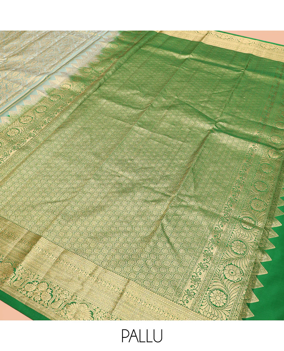 Green Kanchipuram Silk Saree Embellished with Jacquard Design, Highlighted by a Contrast Border of Thilakam, Muthu, Rekku, Manga, Chakram, and Floral Designs, Majestically Woven Pallu Steeped with Chakram Designs, and Paired with a Matching Blouse - Image 5