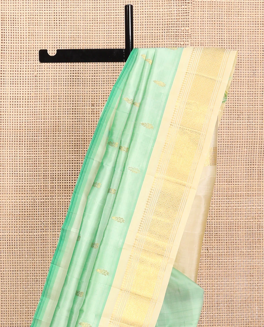 Green Kanchipuram Silk Saree, Featuring Zari Buttas, a Contrast One-Sided Border of Panner Sombu, Muthu, Banaras, and Jaal Design, Zari Design Pallu, and No Blouse - Image 3