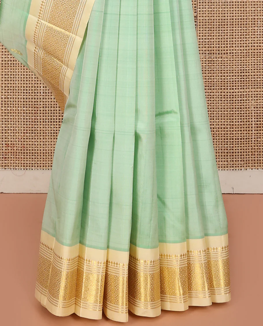 Green Kanchipuram Silk Saree, Featuring Zari Buttas, a Contrast One-Sided Border of Panner Sombu, Muthu, Banaras, and Jaal Design, Zari Design Pallu, and No Blouse - Image 4