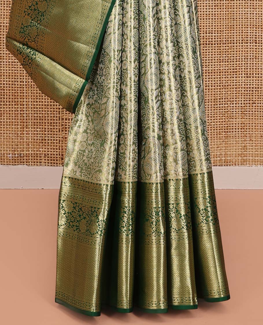 Green Kanchipuram Tissue Silk Saree, Majestically Detailed with Jacquard Designs on Its Body, Highlighted by a Zari Border of Jaal, and Floral Designs, Intricately Designed Pallu, and Paired with a Matching Blouse - Image 4