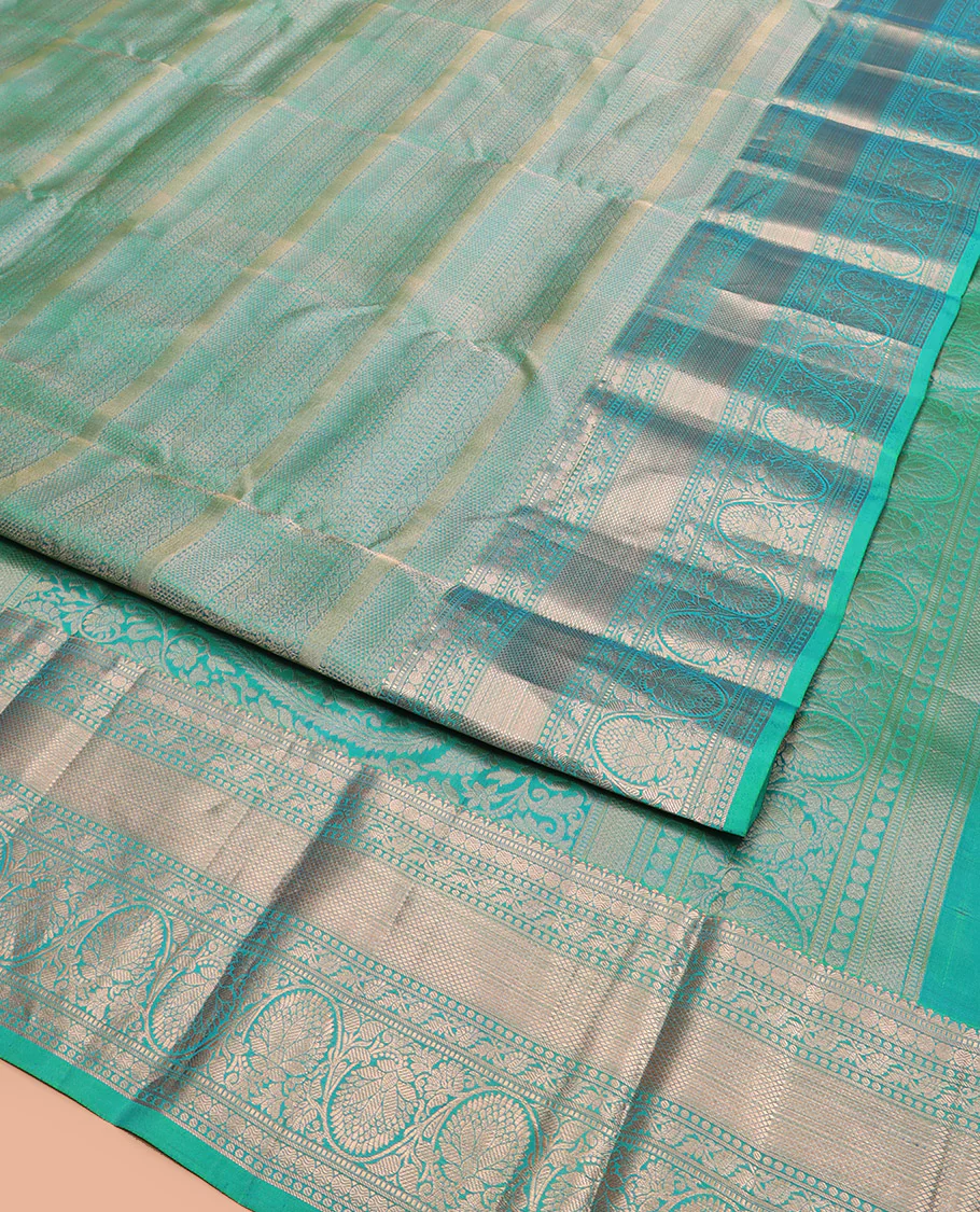 Green Kanchipuram Wedding Silk Saree Decorated with Jacquard Designs, Highlighted with a Zari Border of Rekku, Muthu, Rudraksham, Mayil Kann, and Dhavani Kodi Designs, Artfully Detailed Pallu, and Paired with a Matching Blouse - Image 3