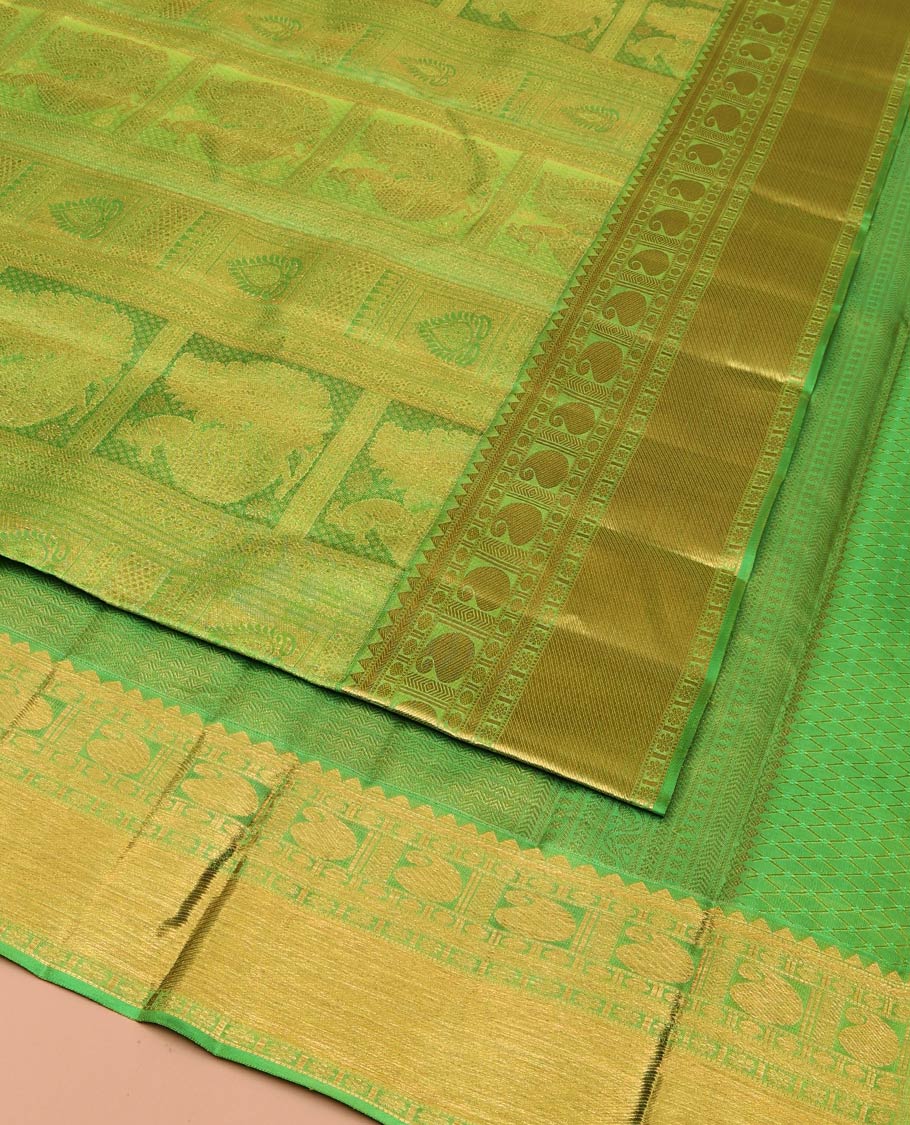Green Kanchipuram Wedding Silk Saree, Entralled with Jacquard Design On Its Body, Highlighted by Zari Border of Rekku, Kathir, Muthu, Manga and Zari Stripes, Grand Pallu and Paired with a Matching Blouse - Image 2