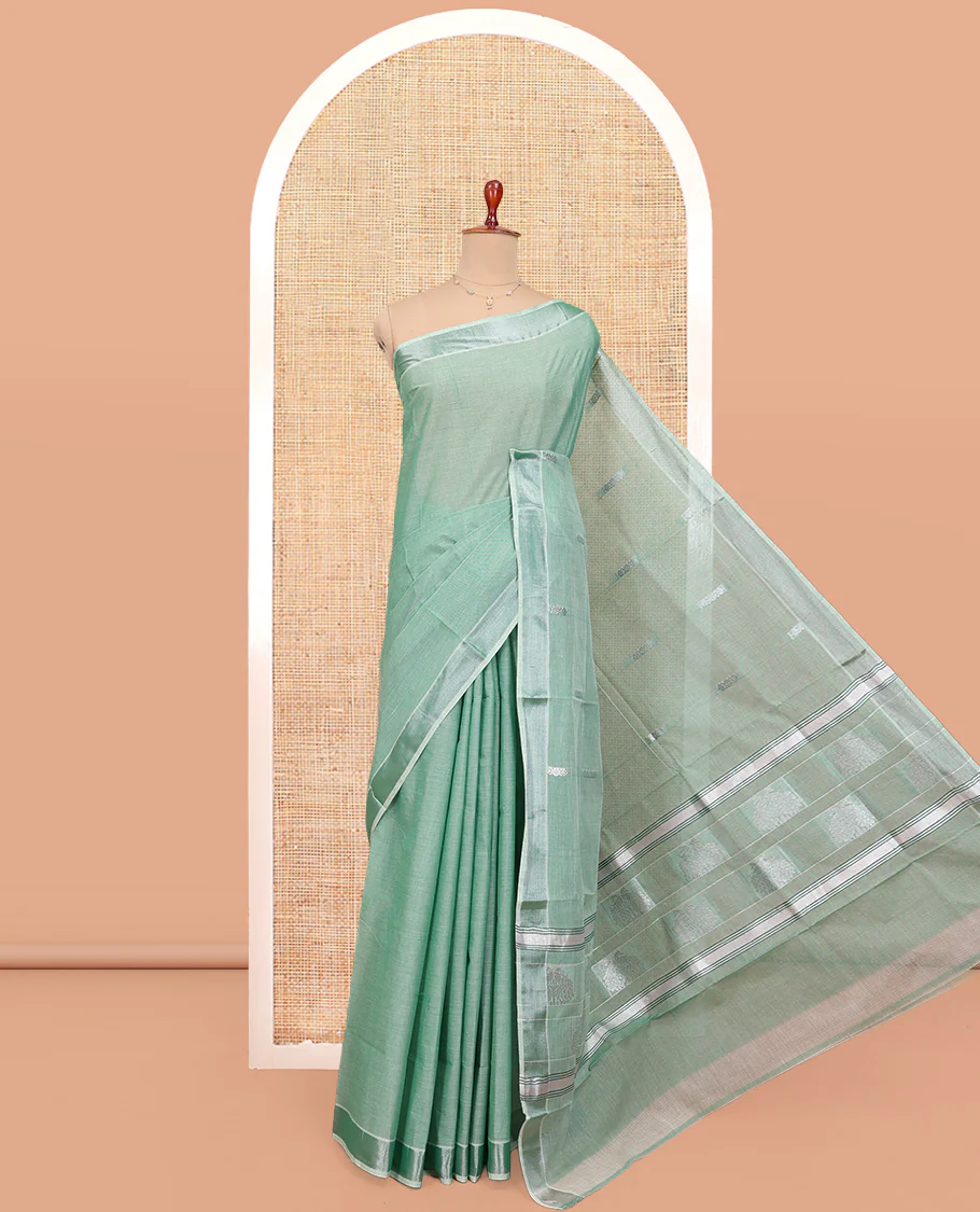 Green Kerala Cotton Saree, Woven with Buttas All Over Its Body, a Zari Bavanji Border, Pallu of Intricate Designs, and Paired with a Matching Blouse