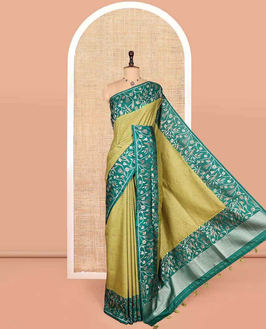 Green Matka Silk Saree, Finely Crafted with Buttas on Its Body, Complemented by Contrast Floral Vine and Bird Design Border, Pallu of Floral Vine and Bird Design, and Paired with a Contrast Blouse