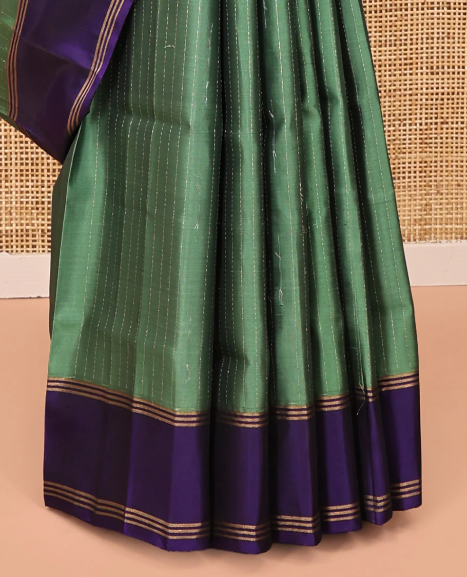 Green Mayuri Lite Silk Mix Saree, Sparsely Sparkled with Muthu Stripes on Its Body, Complemented by a Contrast Border, Jaal Pallu, and Paired with a Contrast Blouse - Image 4