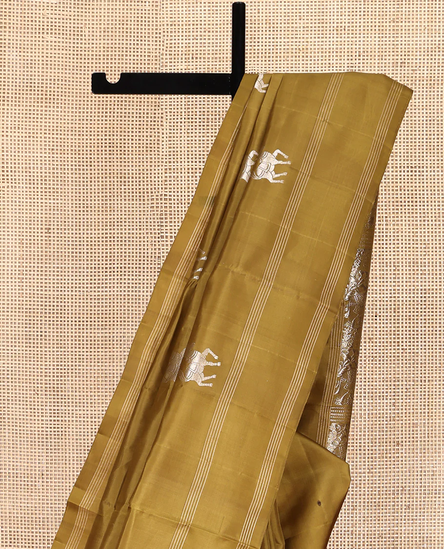 Green Mayuri Soft Silk Saree, Artfully Woven with Horse Buttas All Over Its Body, Highlighted by Stripes Border, Pallu of House and Elephant Motifs, and Paired with a Matching Blouse - Image 3