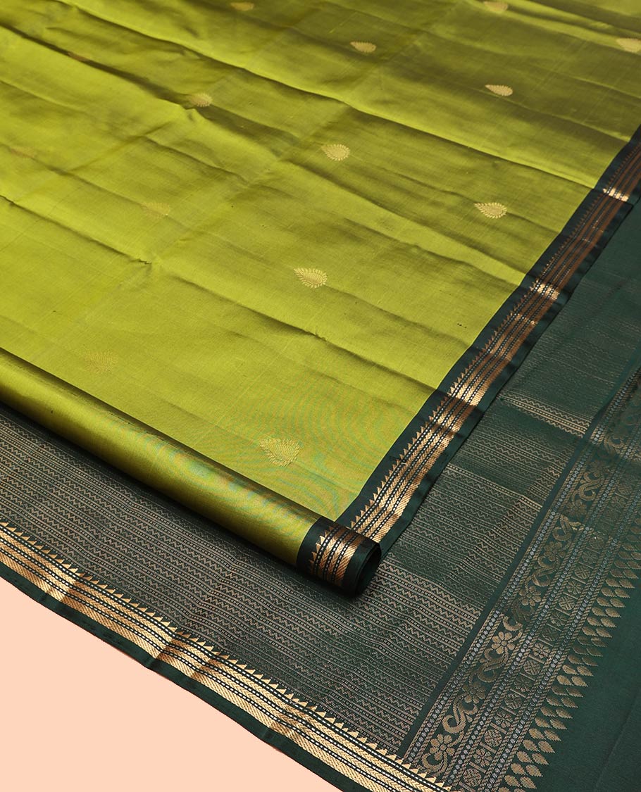 Green Mayuri Soft Silk Saree, Beautifully Bedecked with Zari Buttas All Over Its Body, Complemented by Contrast Border of Ara Bogudi, Muthu, Banaras, and Kathir Designs, Pallu of Neli, Muthu, and Banaras Designs, and Paired with Contrast Blouse - Image 2
