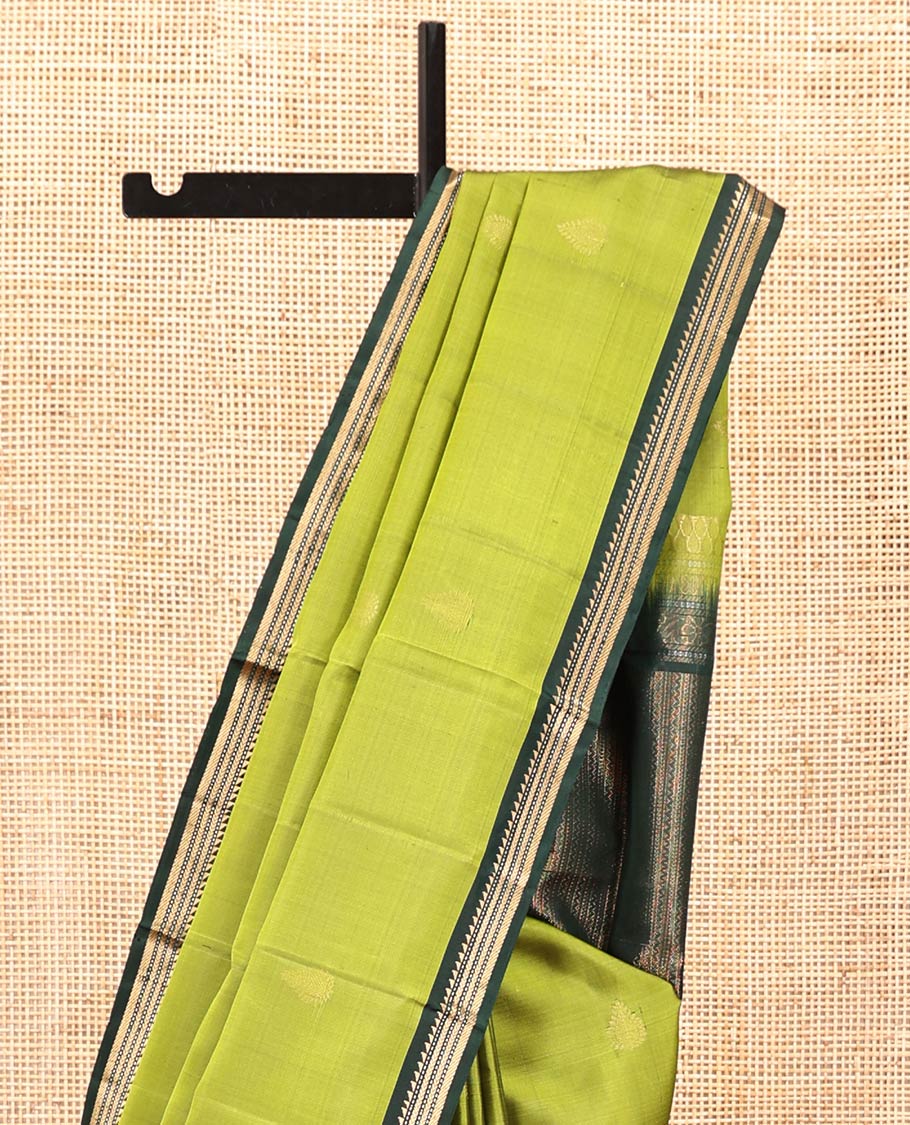 Green Mayuri Soft Silk Saree, Beautifully Bedecked with Zari Buttas All Over Its Body, Complemented by Contrast Border of Ara Bogudi, Muthu, Banaras, and Kathir Designs, Pallu of Neli, Muthu, and Banaras Designs, and Paired with Contrast Blouse - Image 3