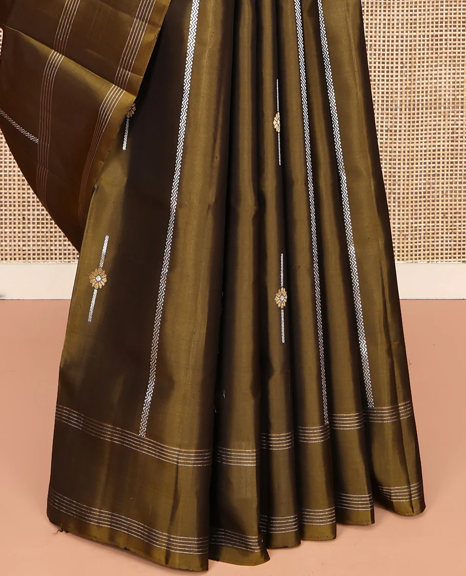 Green Mayuri Soft Silk Saree, Graced with Zari Buttas All Over Its Body, Highlighted by Zari Striped Border, Pallu Steeped with Zari Buttas, and Paired with a Matching Blouse - Image 4
