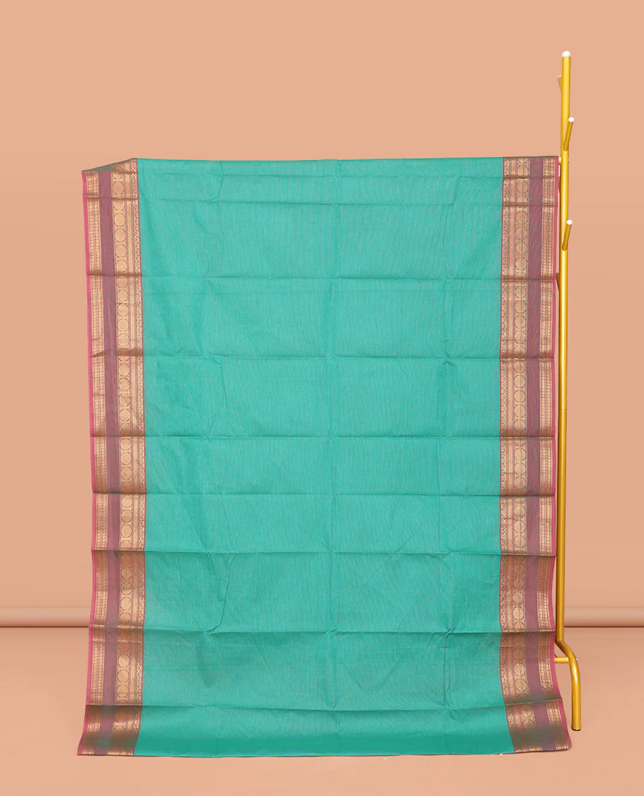 Green Plain Chettinad Cotton Saree, Complemented by a Contrast Traditional Zari Design Border, Subtly Striped Pallu, and Paired with a Matching Blouse