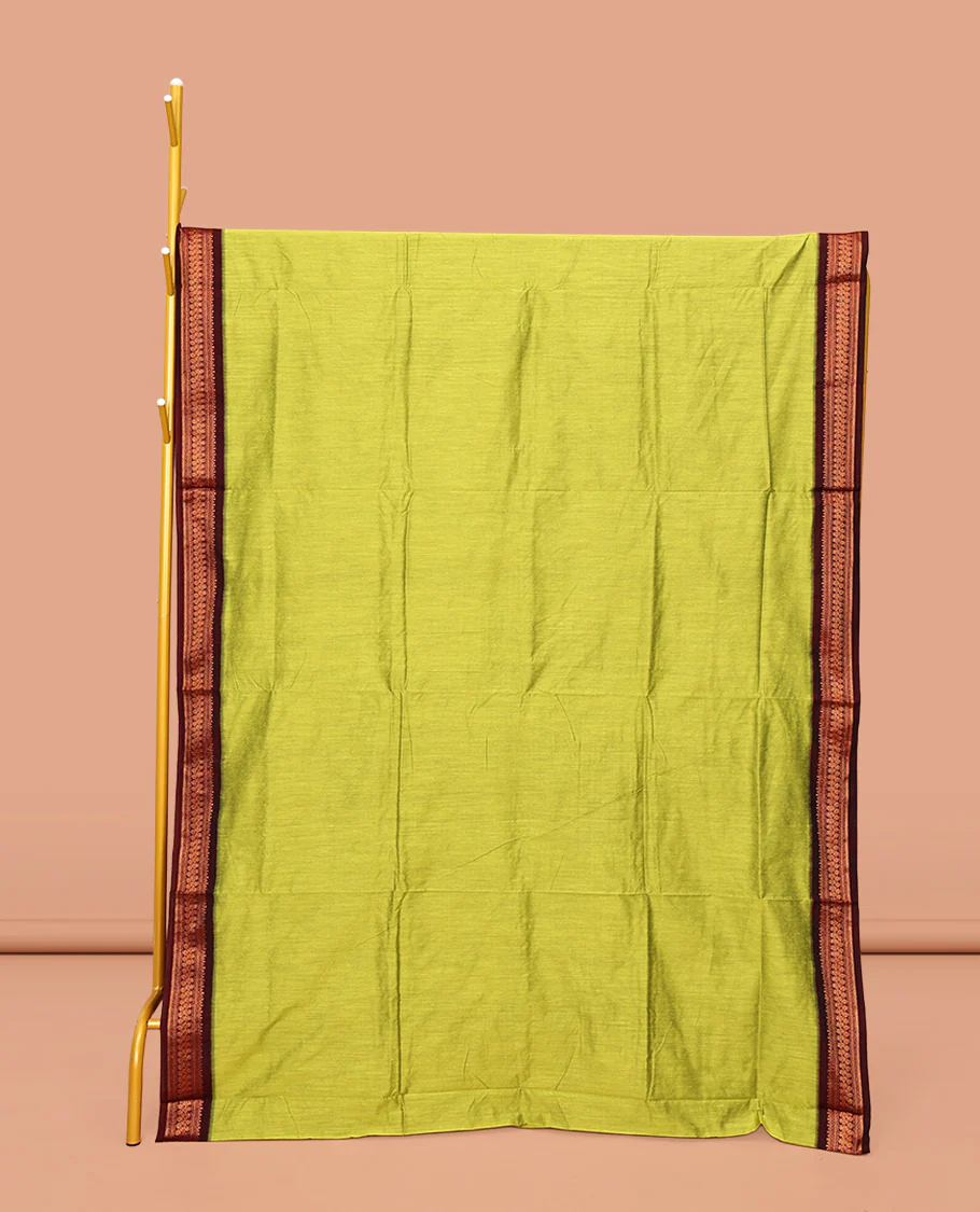 Green Plain Kalyani Cotton Saree, Complemented by a Contrast Traditional Zari Design Border, Pallu Features Traditional Zari Designs, and Paired with a Contrast Blouse
