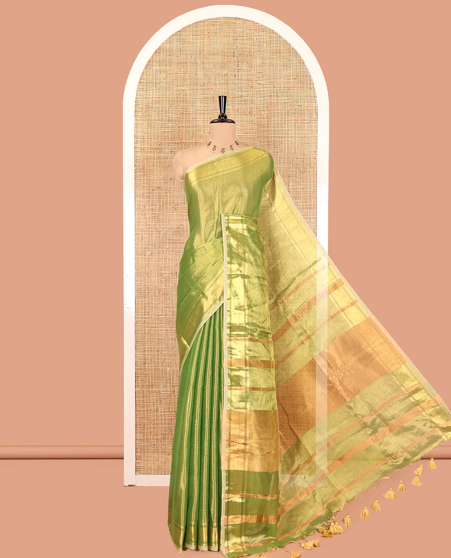 Green Plain Khadi Tissue Saree, a Gleaming Zari Bavanji Border, Golden Zari Striped Pallu, and Paired with a Matching Blouse
