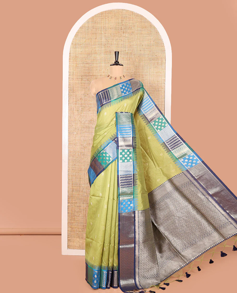 Green Semi-Raw Silk Saree, Adorned with Buttas All Over Its Body, Complemented by Contrast Meenakari-Style Woven Border of Geometric Zari Designs, Majestically Detailed Pallu, and Paired with a Contrast Blouse