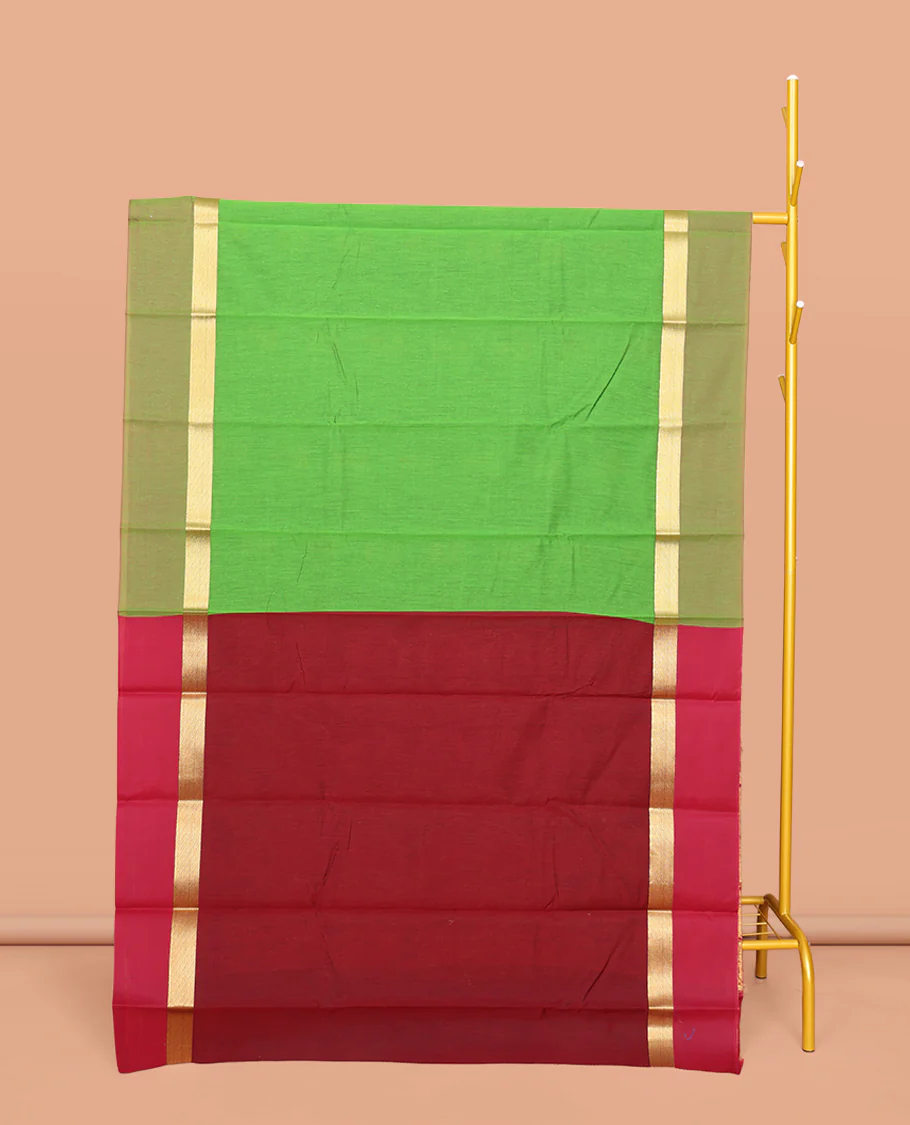 Green Semi-Silk Cotton Saree, Decked Up with Peacock Buttas All Over Its Body, Highlighted by a Zari Border, Pallu Artfully Woven with Peacock Designs, and Paired with a Contrast Blouse
