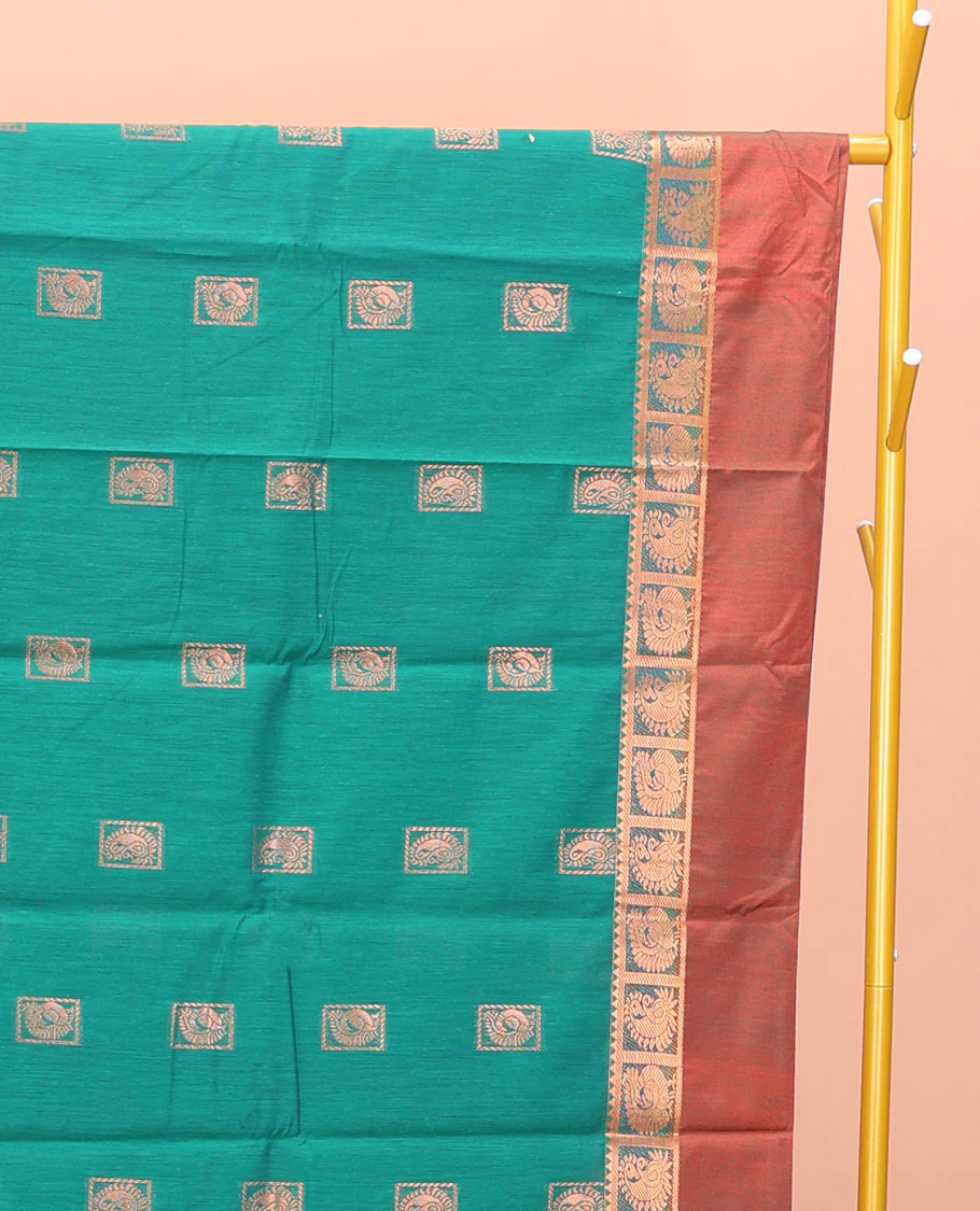 Green Semi-Silk Cotton Saree, Impeccably Styled with Buttas All Over Its Body, Complemented by a Contrast Peacock Design Kal Eragina Border, Pallu Steeped with Elephant Design, and Paired with a Matching Blouse - Image 2