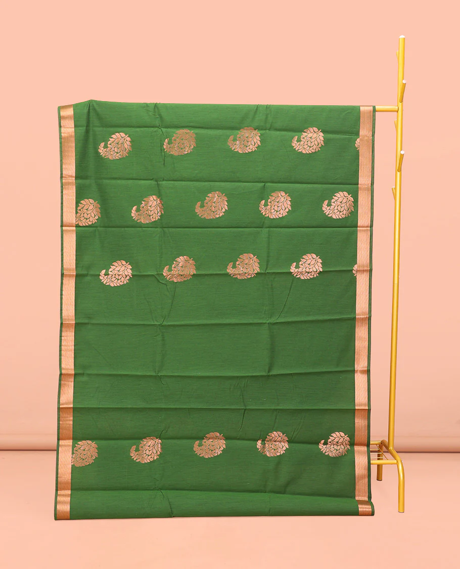 Green Semi-Silk Cotton Saree, Masterfully Woven with Paisley Zari Buttas All Over Its Body, Highlighted by a Zari Border, Pallu of Floral and Paisley Design, and Paired with a Matching Blouse