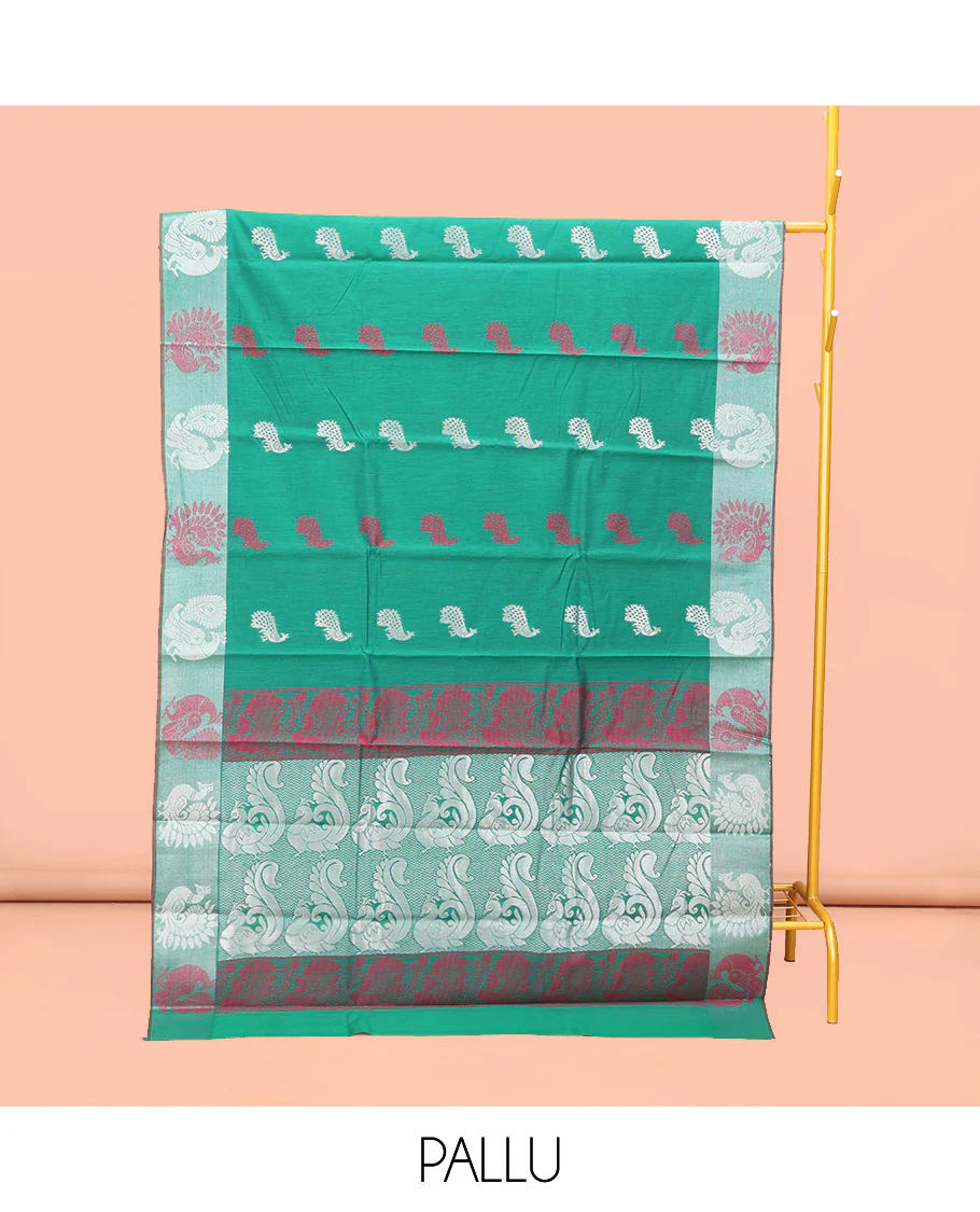 Green Semi-Silk Cotton Saree, Styled with Peacock Buttas All Over Its Body, Highlighted by a Self-Border  of Peacock Designs, Pallu Steeped with Peacock Zari Design, and Paired with a Matching Blouse - Image 3