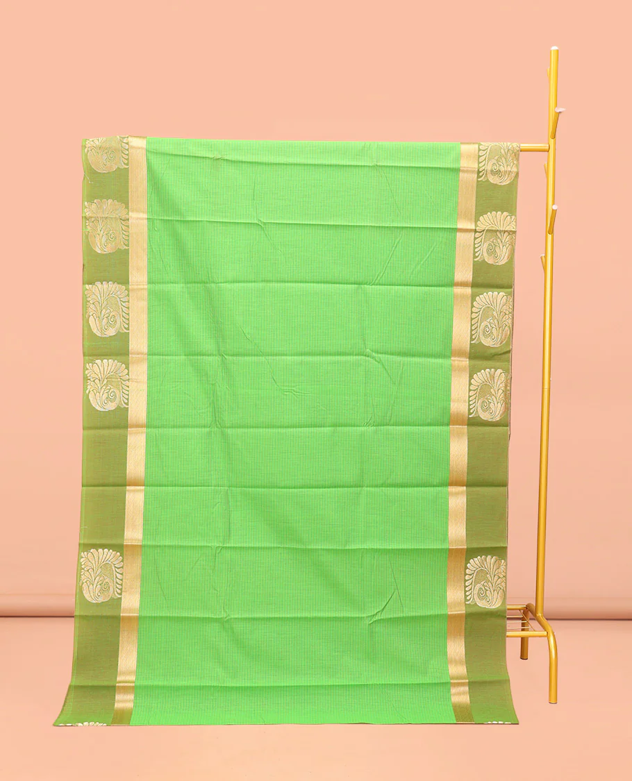 Green Semi-Silk Cotton Saree, Subtly Sparkled with Stripes All Over Its Body, Complemented by a Contrast Zari Buttas Woven Border, Pallu of Bird and Paisley Designs, and Paired with a Matching Blouse