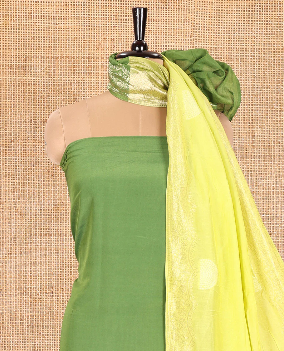 Green Semi Silk Material Churidar Set, Subtly Made Plain Top, a Plain Santoon Bottom, and Is Paired with a Dual-Colored Bandhani Motifs Semi Silk Dupatta - Image 3