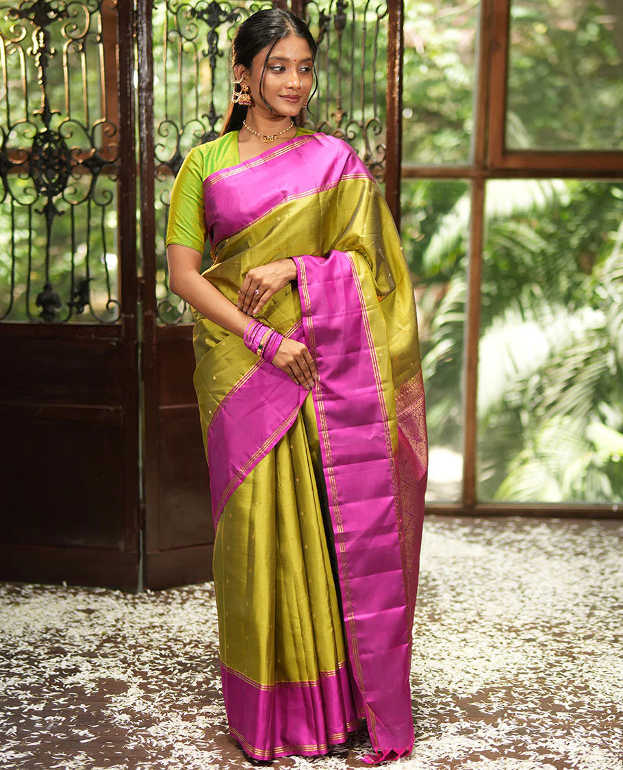 Green Vasundhara Lite-Silk Mix Saree, Beautifully Decorated with Zari Buttas All Over Its Body, Complemented by Contrast Rettai Pettu Border of Zari Stripes, Pallu Accentuated with Jaal Designs, and Paired with a Contrast Blouse - Image 4