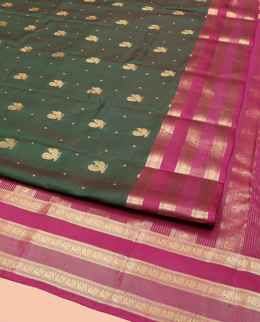 Green Vasundhara Lite Silk Mix Saree, Graced with Mayil Buttas All Over Its Body, Complemented by a Contrast Border of Neli, Muthu, and Chakram Designs, Pallu Steeped with Traditional Designs, and Paired with a Contrast Blouse - Image 2