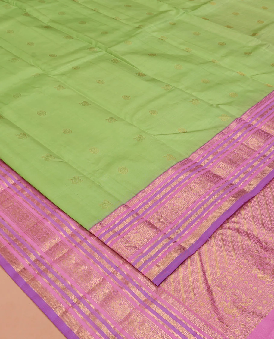 Green Vasundhara Silk Saree, Accentuated with Mayil and Chakram Buttas All Over Its Body, Complemented by a Contrast Border of Rekku, Muthu, Kathir, Poun, Mayil and Mayil Kann Designs, Grand Pallu, and Paired with a Contrast Blouse - Image 2
