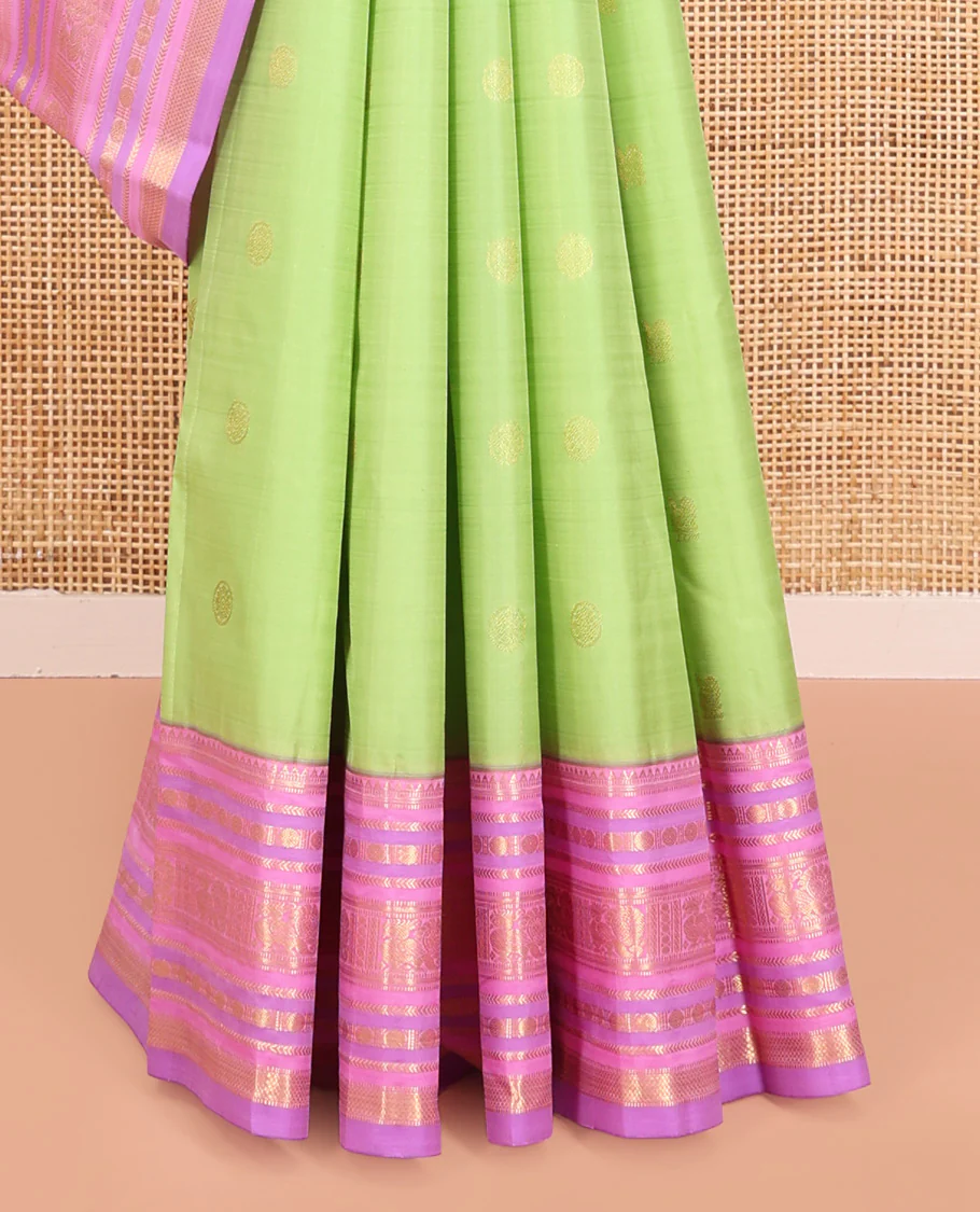 Green Vasundhara Silk Saree, Accentuated with Mayil and Chakram Buttas All Over Its Body, Complemented by a Contrast Border of Rekku, Muthu, Kathir, Poun, Mayil and Mayil Kann Designs, Grand Pallu, and Paired with a Contrast Blouse - Image 4