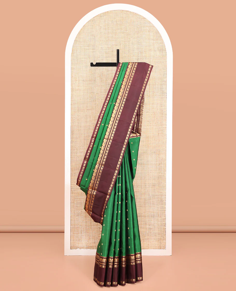 Green Vasundhara Silk Saree, Elevated with Zari Buttas All Over Its Body, Complemented by a Contrast Rettai Pettu Border of Yaanai Designs, Grand Jaal Pallu, and Paired with a Contrast Blouse