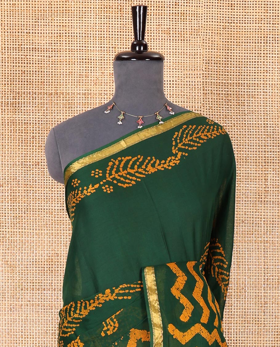Green wax batik-style zig-zag printed pure cotton saree, gold zari piping border, human figurines batik printed pallu, and a matching blouse - Image 3
