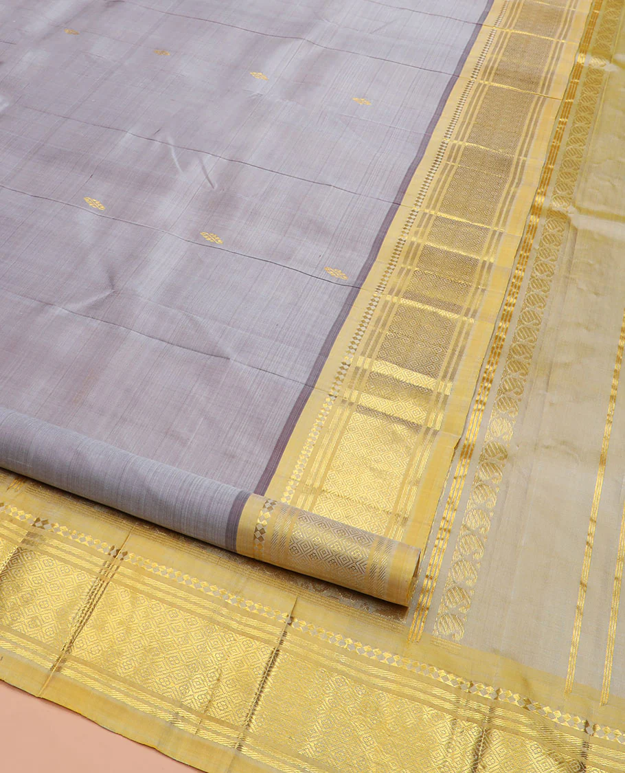 Grey Kanchipuram Silk Saree Detailed with Zari Buttas, Highlighted by Contrast One-Sided Border of Paneer Sombu, Banaras, and Jaal Designs, Pallu Accentuated with Floral Zari Design, and Comes Without a Blouse - Image 2