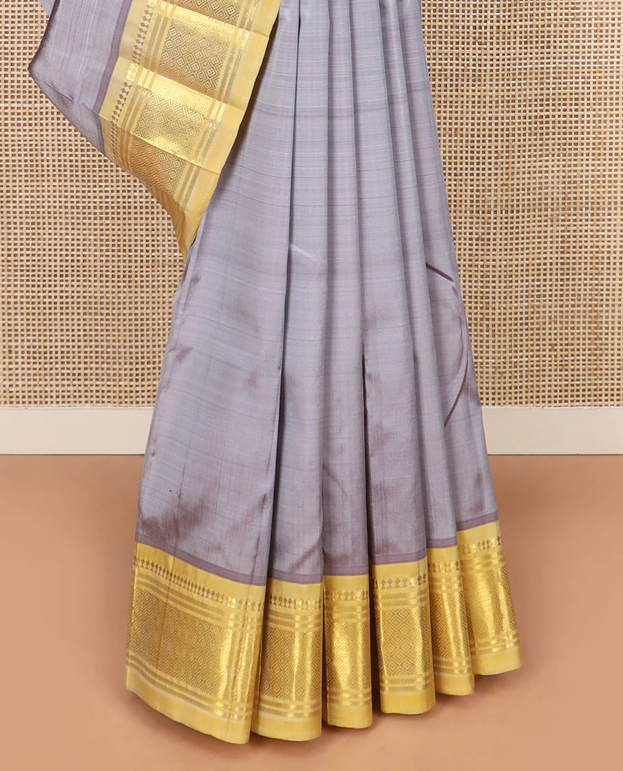 Grey Kanchipuram Silk Saree Detailed with Zari Buttas, Highlighted by Contrast One-Sided Border of Paneer Sombu, Banaras, and Jaal Designs, Pallu Accentuated with Floral Zari Design, and Comes Without a Blouse - Image 4