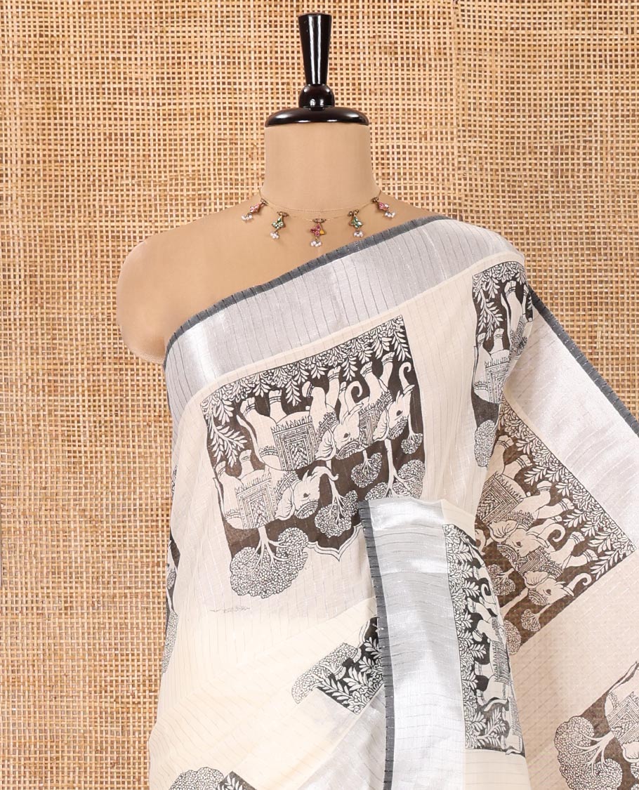 Half-White Kerala Cotton Saree, Artfully Detailed with Kalamkari-Style Elephant Motifs on Its Body, Highlighted by Zari Border, Pallu Pictures the Same Print, and Paired with a Matching Blouse - Image 2